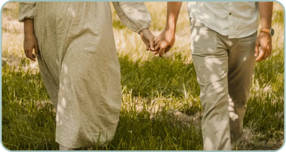 Couple Holding Hands and Walking Together
